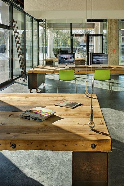 Heldergroen Offices by Zecc Architects. LOVE the construction of the table top (minus the holding cables) Industrial Pantry, Modern Industrial Office Design, Rustic Workspace, Modern Industrial Office, Haarlem Netherlands, Wood Benches, Industrial Office Design, Loft Office, Fun Office