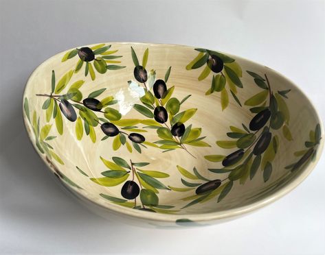 Hand-painted, made in Italy  has a beige painted background with olive design.  30 cm D or approx. 11 in (medium serving bowl)  Sizes are approximate as each item is hand made so variations occur.  Dishwasher safe. Cute Bowl Designs Painted, Green Pottery Painting, Bowl Ceramic Painting, Hand Painted Pottery Bowls, Pottery Painting Bowl, Bowl Painting Ideas, Bowl Painting, Italian Bowl, Olive Design