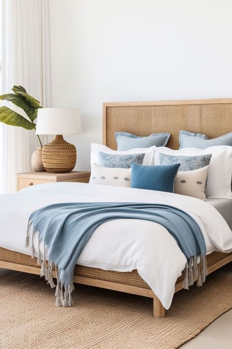 Beach House Interior Coastal Cottage Blue And White, Rattan Headboard Bedroom Decor, Blue White Apartment, Coastal Bedroom Modern, Beige Coastal Bedroom, Beach House Beds, Coastal Bedroom Headboard, Blue And Rattan Bedroom, Cream And Blue Bedding