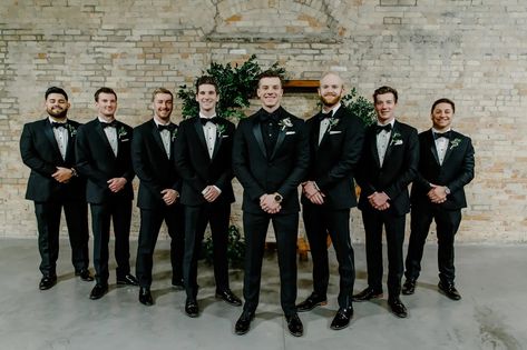 Men’s Wedding Black Suits, Black Tux Winter Wedding, Classic Black And White Groomsmen, Groom All Black Suit With Groomsmen, Winter Wedding Colors Black, Black And Green Wedding Groomsmen, Groomsmen Attire For Winter Wedding, Black Suit Wedding Groomsmen Color Schemes, How To Differentiate Groom From Groomsmen