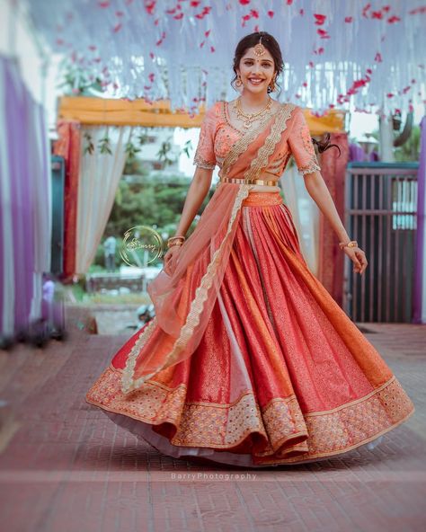 A Pretty kanjivaram lehenga for this beautiful bride. The intricate embroidered blouse adding oodles of charm to the ensemble. Couples with her subtle makeup and minimal jewellery the look is an inspiration to ape for. PC: barrys.photograph #indianwedding #wedding #indianbride #bride #southindianbride #southindianwedding #saree #kanjivaram #kanjivaramsaree #lehenga #wittyvows #indianjewellery Saree Lehenga Designs, Kanjivaram Lehenga, Bridal Half Saree, Saree For Engagement, Saree South Indian, Engagement Dress For Bride, South Indian Wedding Saree, South Indian Bride Saree, Kanjeevaram Sarees