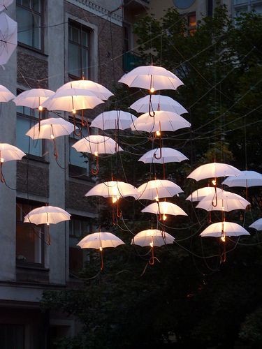 For the back yard entertaining area. You know, the spot with all the comfy chairs and long tables. #lights #ingenious #clever Umbrella Street, Umbrella Lights, Salou, Street Light, Garden Lighting, Patio Umbrella, Outdoor Spaces, Outdoor Lighting, At Night