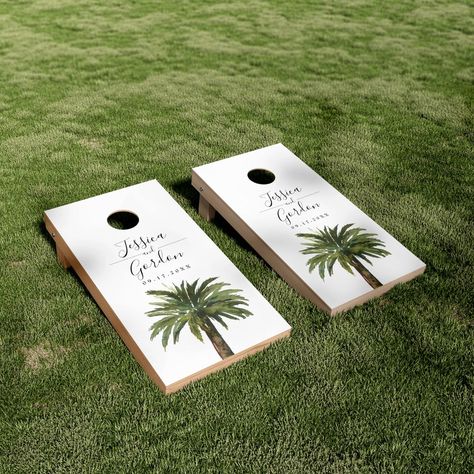 A unique palm tree-themed set of cornhole boards tailored specifically to your future wedding on the beautiful coast or island.  They feature a minimal style illustration of a single palm tree.  Above this rest the unique names of the bride and groom in an elegant cursive style font. Wedding Reception Ideas Beach, Island Themed Wedding, Outside Beach Wedding, Classic Beach Wedding, Casual Beach Wedding Decor, Wedding Tropical Theme, Coastal Beach Wedding, Classy Tropical Wedding, Palm Tree Wedding