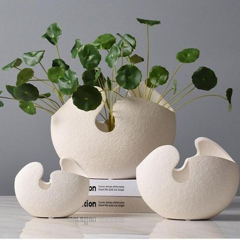 These stunning ceramic cracked egg shaped vases will make a statement in any space. These vases can hold faux, dried flowers or fresh plants or just group them together to make a bold artistic statement. These vases can be displayed alone or with any display to create a work of art. DETAILS AND CARE Includes: 1 Vase No Stucco Texture, Large Bowls, Broken Egg, Cracked Egg, Art Details, Timeless Decor, Ceramic Flower Pots, Table Top Display, Pottery Designs