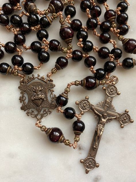 This beautiful Sacred Heart rosary is made with 8mm and 10mm garnet Gemstones. It is wire-wrapped with strong 20 gauge solid bronze wire and chain. The medals are solid bronze.