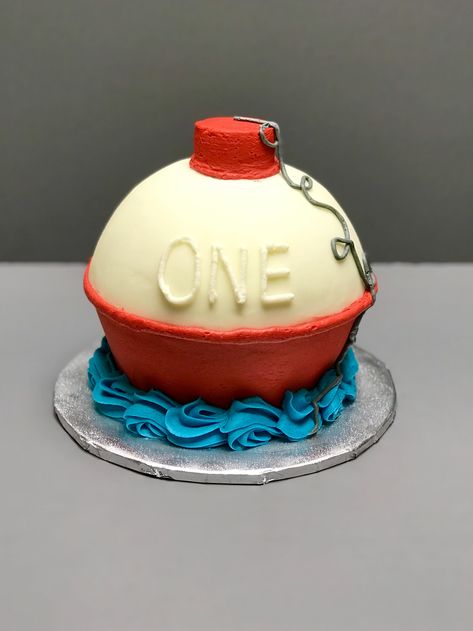 Vanilla fishing bobber smash cake with buttercream Bobber Smash Cake, Fishing Birthday Party Boys, Fishing Themed Birthday Party, Fishing Birthday Party, Boys First Birthday Party Ideas, Boys 1st Birthday Party Ideas, Fishing Bobber, Fishing Birthday, Terraria