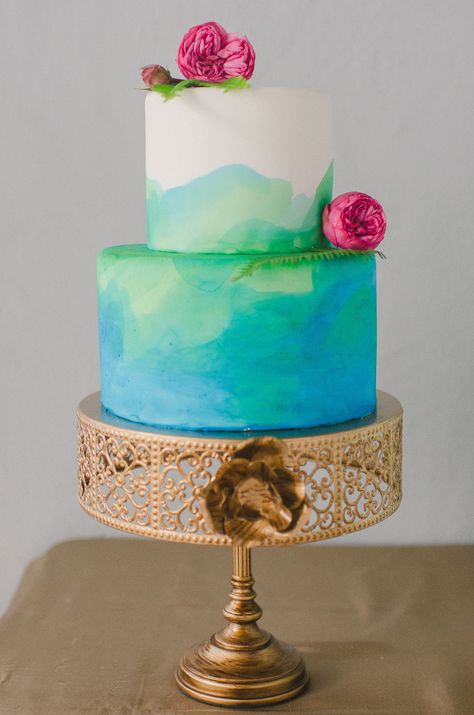 Sweet watercolor cake. Photography: RachelPearlmanPhotography.com, Cake: CakeStandBakery.com - Read More: http://www.stylemepretty.com/2014/05/29/winter-to-spring-wedding-inspiration/ Blue And Green Cake Birthday, Blue Green Cake, Blue And Green Cake, Bakery Photography, 21 Cake, Watercolor Wedding Cake, Painted Wedding Cake, Art Cakes, Quinceanera Cakes