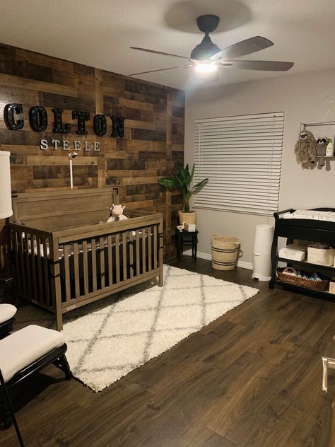 Pallet Wall Nursery, Wood Wall In Nursery, Wood Accent Wall In Nursery, Nursery With Wood Floors, Wooden Accent Wall Nursery, Wood Themed Nursery, Western Accent Walls, Baby Boy Nursery Themes Rustic, Wood Accent Wall Nursery