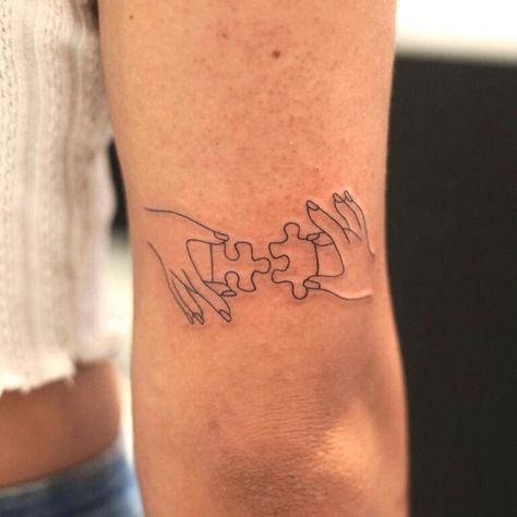 Jigsaw Tattoo Puzzle Pieces, Jigsaw Piece Tattoo, Puzzle Tattoo Family, Puzzle Piece Tattoo Family, Special Needs Tattoo, Tattoo Of Hands Holding Something, Puzzle Tattoo Design, Tattoo Puzzle Piece, Puzzle Pieces Tattoo