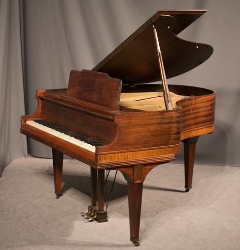 This beautiful piano is made of Honduran Mahogany wood and is of the Traditional style.  The base of the cabinet is trimmed in light walnut, giving a lovely contrast to the overall appearance of the instrument.  Despite their small size, these Emerson baby grand pianos are known to have a large, full tone quality. For more information or to purchase, please visit our website. #pianoforsale #furniture #highendfurniture #homedecor #furnitureforsale Grand Piano Room, Pretty Instruments, Piano Grand, Modern Treehouse, Piano Living Rooms, Piano Restoration, Highend Furniture, Piano Shop, Beautiful Piano