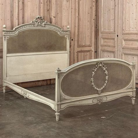 19th Century French Louis XVI Painted Bed with Caning is a remarkable work of the furniture maker's art!  Sculpted from walnut, it features artistry exhibited from the crown of the headboard to the arbalette base of the footboard which happens to match the side rails.  The gracefully arched headboard consists of complex hand-carved molding surrounding a Greek coin border all across the crown, centered with an exquisitely rendered wreath of roses tied together with flowing ribbon.  Egg finials on French Country Headboard, White French Furniture, Greek Bedroom, French Chandeliers, Baroque Bed, French Design Style, Antique French Bed, Vintage Headboard, Antique Headboard