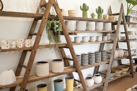 Ladder Market Display, Rustic Retail Display Ideas, Market Display Shelves, Diy Store Shelves, Camping Store Interior, Diy Shop Shelving Ideas, Rustic Shop Display, Diy Retail Display Shelves, Rustic Store Design