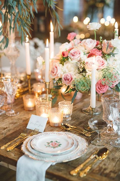 A lush romantic scene has all the right ingredients for a vintage glam wedding shoot dripping in shades of pinks, splashes of red and one romantic setting.