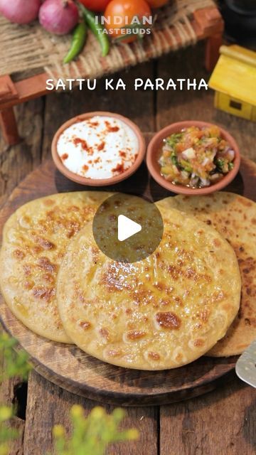 Swarna | Recipe video creator on Instagram: "Winter Comfort Ep 1 - Sattu ka paratha 😋 Ingredients: For sattu stuffing: Sattu - 2 cups Garlic - 2 tbsp Ginger -1 tbsp Green chilli - 1 tbsp Onion - 1/3 cup Kalonji - 1/2 tsp Ajwain - 1 tsp Salt to taste Achaar -1 tbsp Lemon juice - 1 tbsp Mustard oil - 2 tbsp Coriander leaves - 3 tbsp - Mix well and set aside. - Make semi soft roti dough using wheat flour water and salt. - Take a ball size portion of the dough. - Make space in the centre. Place the sattu filling. - Enfold the dough. Dip in some aata and roll out to make a thick paratha. - Place on a hot tawa and cook over medium heat on both sides. - Apply generous amount of ghee and cook until golden and crispy. - Serve hot with roasted tomato chutney and fresh curd. - Enjoy ☺️ ** Roaste Sattu Ka Paratha, Sattu Recipe, Sattu Paratha, Chilli Chutney Recipes, Soft Roti, Indian Cooking Videos, Tomato Chutney Recipe, Roti Recipe, Naan Recipe