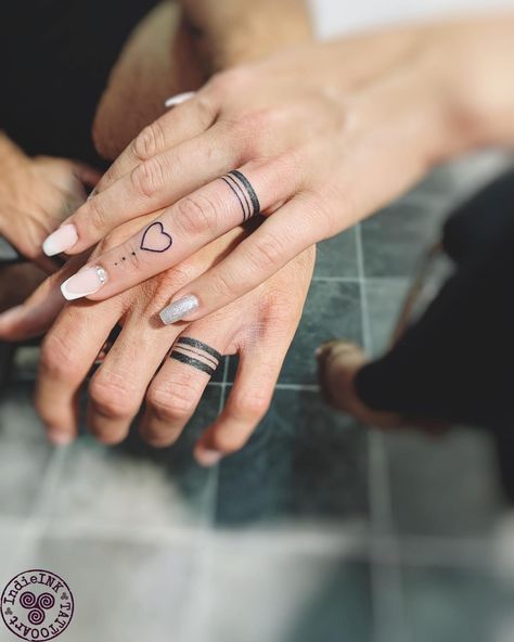 30+ Unisex Wedding Ring Tattoos for Couples - 100 Tattoos Couple Tattoos For Finger, Married Couple Hand Tattoos, Tattoo Ideas For Ring Finger, Marriage Hand Tattoo, Couple Tattoo Ring Finger, Ring Tattoo Ideas Women, Wedding Bands For Women Tattoo, Men Tattoo Ring Wedding Bands, Womens Wedding Ring Finger Tattoo