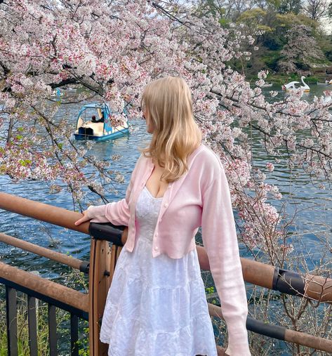 spring aesthetic, flowers, lake pics, spring style, cherry blossoms, sakura season, pink flowers, pink outfit, pink style, photoshoot inspo, spring dress, white dress, pink cardigan, blonde hair, blonde hair inspo, feminine style inspo, cute style ideas, coquette, girly outfits, summer fashion inspo, summer dress, summer outfits Cherry Blossom Season Outfit, Spring Outfits Cherry Blossoms, Cherry Blossom Picnic Aesthetic, Sakura Festival Outfit, Cherry Blossoms Outfit Ideas, Sakura Season Outfit, Cherry Blossom Viewing Outfit, Dc Cherry Blossoms Outfit, Cherry Blossom Outfit Ideas Japan