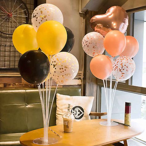 Two balloon stand kits with seven balloons each in different colors on a table in a coffee shop. Centerpiece Stand Diy, Centerpiece Stand, Balloon Stand, Balloon Centerpiece, Diy Table Top, Balloons Decoration, Balloon Stands, Birthday Balloon Decorations, Decoration Party