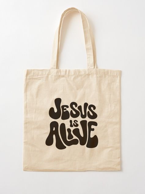 "Jesus is Alive (Black)" Tote Bag for Sale by PraiseandGlory | Redbubble Totes Bag Design Ideas, Eco Bag Design Ideas, Christian Tote Bag Design, Jesus Tote Bag, Tote Bag Ideas, Decorated Tote Bags, Tote Bag Christian, Tote Bag Designs, Handpainted Tote Bags