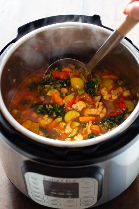 Quick, easy, nourishing and delicious Instant Pot Vegetable Soup is perfect year round. Cauliflower, asparagus, bell pepper, zucchini, carrot, celery, kale, and chickpeas make for a flavor explosion! #instantpot #vegetablesoup #soup #easyrecipes #healthy Soup In Instant Pot, Instant Pot Vegetable Soup, Gut Recipes, Best Zucchini Recipes, Zucchini Carrot, Pot Image, Instant Pot Soup Recipes, Instant Pot Soup, Vegetable Soup Recipes