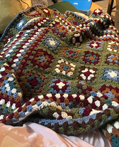 made this beautiful moody take on a granny square blanket early this year using my acrylic scrap yarn 💙 Vintage Crochet Decor, Grandma Blanket Crochet, Mismatched Granny Square Blanket, Repurpose Crochet Blankets, Earthy Granny Square, Earth Tone Granny Square, Kamryn Cain Crochet, Granny Square Book Blanket, Crochet Blanket Patchwork