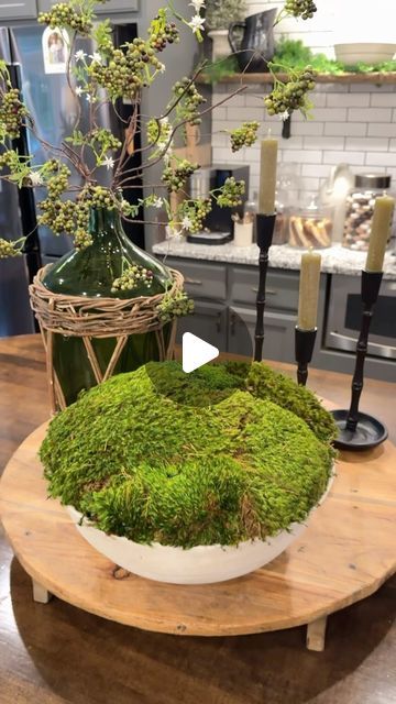 Farmshenanigans Wesley Turner on Instagram: "What Do You Think? These sell for hundreds but you can make your own. Comment Below “I need supplies” and I’ll send you everything I used. 
.
Tips: 
-Wetting your moss can help make it more pliable and easier to work with. 
-Use scissors to cut off the back of the moss if it is too thick or if you need to change shape. 
-Rolling the edges of the moss really makes a difference! 
-Use Sheet Moss for the base and any type of fluffy moss for the second layer to create the mound. 
-
- This is such an easy way to give your decor a high end design look" Moss Filled Vase, Moss Pots Ideas, Wedding Centerpieces With Moss, Spanish Moss Centerpiece, Diy Moss Centerpiece, Moss Arrangements Floral Design, Dry Arrangements Ideas, Moss Christmas Decorations, Moss Flower Arrangements