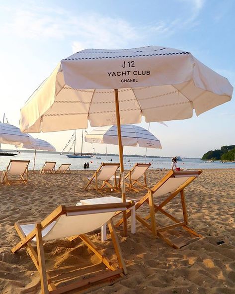 J12 YACHT CLUB, (SUNSET BEACH HOTEL), Shore Road, Shelter Island Heights, New York, USA, "Chanel beach umbrellas cover the sprawling coastline on Crescent Beach celebrating Chanel's iconic J12 watch",  photo by Tall Paul?, pinned by Ton van der Veer Kids Beach Chair, Swimming Pool Chair, Rattan Beach Chair, Chanel Beach, Single Summer, Lounger Chair, Pool Lounge Chairs, Folding Beach Chair, Pool Chairs