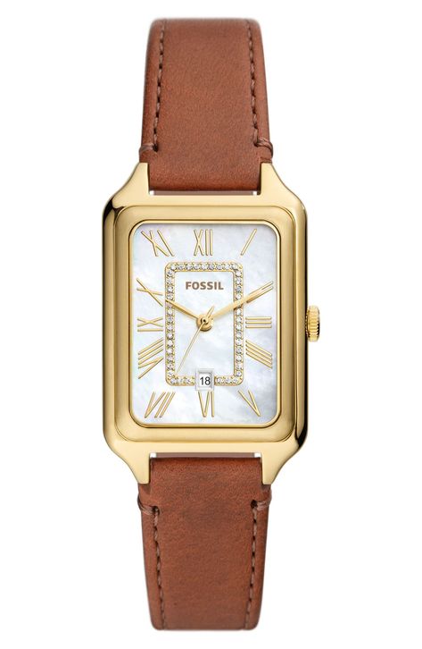 A slim rectangular watch with a brown leather strap showcases a mother-of-pearl dial with elongated Roman numeral markers and sparkling cubic zirconia. 26mm case; 14mm band width Buckle closure Quartz movement Date window Mineral crystal face Mother-of-pearl dial Stainless steel with ionic plating/leather/cubic zirconia Imported Brown Watches, Brown Leather Watch, Leather Strap Watch, Three Hands, Brown Leather Strap, Skagen, Medium Brown, Quartz Movement, Stainless Steel Case