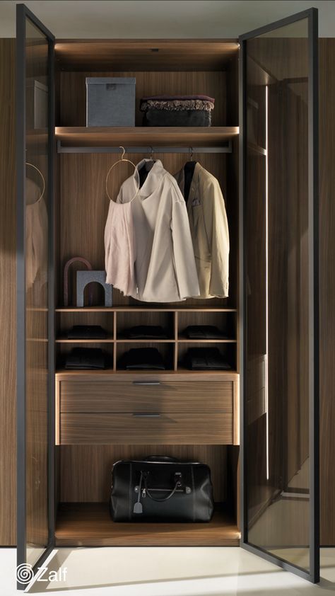 Alterna

The Alterna hinged wardrobe is presented here with City doors in a walnut finish and City Glass doors in transparent smoked glass outlined by a solid burnished frame.

#zalf #gruppoeuromobil #interiors 
#interiordesign #nightsolutions #wardrobe #bedroom #madeinitaly #designforall #homedecor #homedecoration City Doors, Hinged Wardrobe, Wardrobe Bedroom, Tv Set, Tv Sets, Bedroom And Office, Tables And Chairs, Glass Doors, Walnut Finish