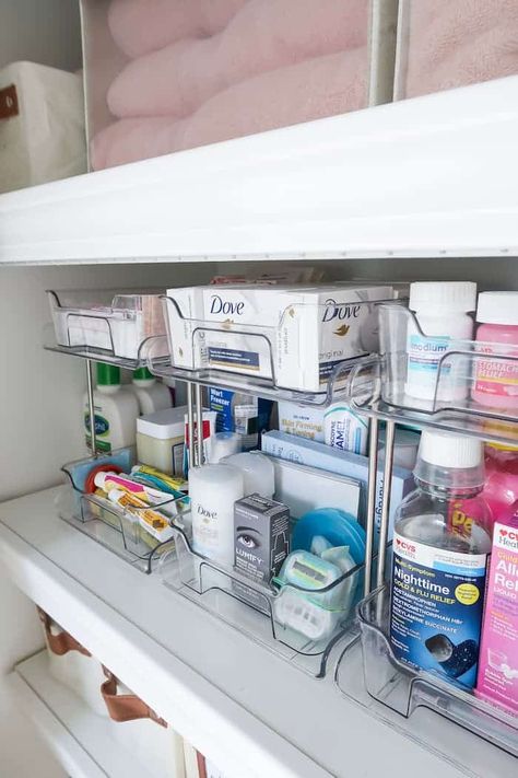 Maximize your linen closet storage space, how to use the top shelf, neutral organizers, and 13 ideas for organizing the linen closet. Deep Shelf Linen Closet Organization, Linen Cleaning Closet Organization, Linen Closet In Bedroom, Deep Linen Closet Makeover, Organizing Ideas For Bathroom Closet, Linen Closet Medicine Organization, Bathroom Linen Closet Organization Master Bath, Open Hallway Linen Closet Ideas, Bathroom Organization Toothbrush