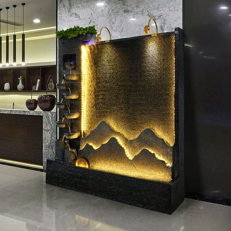 Versatile Design: This rockery water fountain can be used indoors or outdoors, perfect for home, office, hotel, restaurant, bar, or poolside decor. Soothing Waterfalls: Enjoy the calming sound of cascading waterfalls with this fountain's multi-level design. LED Lighting: Built-in LED lights add a warm, ambient glow, creating a serene and relaxing atmosphere. Delivery: We ship the waterfalls via Boat and truck, leave your number ,when it arrives , truck driver will contact you for delivery appoin Water Feature Wall Indoor, Waterfall In House, Indoor Water Fountains Living Rooms, Water Fountain Wall, Water Feature Indoor, Indoor Waterfall Wall, Home Waterfall, Waterfall Decoration, Calming Sound