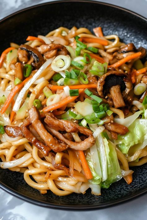 Quick and easy, yaki udon is sure to be a weeknight favorite! This Japanese dish features chewy udon noodles, tender meat, and crisp vegetables, all coated in a savory sauce. Udon Noodle Chicken, Yaki Udon Chicken, Japanese Food Healthy, Udon Chicken, Japanese Recipe Ideas, Udon Noodle Recipe, Japanese Food Recipes, Udon Noodles Recipe, Fried Udon