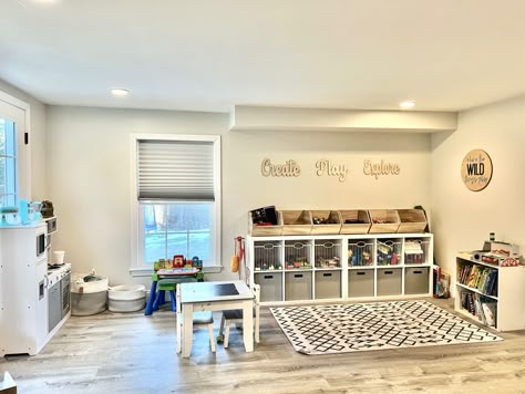 White And Wood Playroom, Basement Toy Room Play Areas, Open Concept Playroom, Workout Playroom Combo, Playroom Rec Room Combo, Open Loft Playroom Ideas Upstairs, Basement Playroom And Tv Room, Simple Basement Playroom, Workout And Playroom Combo