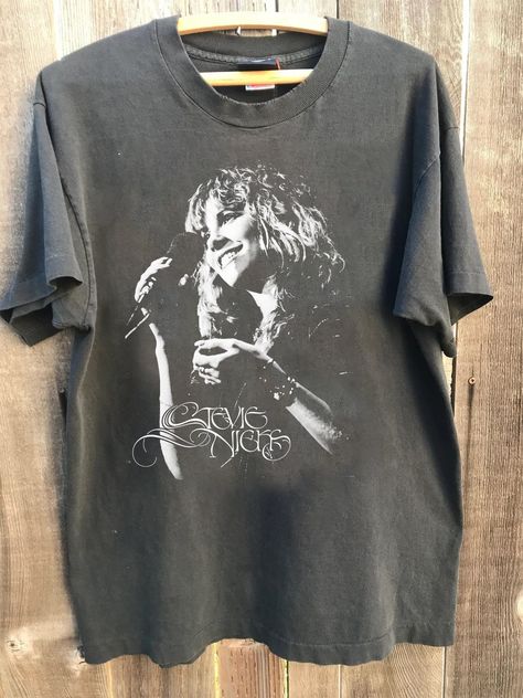 Vintage Stevie Rock Music Shirt,  That I Was Retro Tee, Retro Band Merch, Graphic Shirt, Band Merch, 70s Rock T-Shirt  Heather colors are 52% combed and ring-spun cotton, 48% polyester - Athletic and Black Heather are 90% combed and ring-spun cotton, 10% polyester - Solid Colors 100% pre-shrunk cotton - Fiber content may vary by color FOR THE BEST FIT; (See Size Chart in Images). 1) Lay a t-shirt on a flat surface. 2) Measure the chest area, just under the armpit from side to side find the shirt Musician Merch Ideas, 70s Band Shirts, 70s Band Tees, Fleetwood Mac Merch, Band T Shirt Outfit, Band Tee Aesthetic, Merch Design Ideas, Band Shirt Ideas, Fleetwood Mac Shirt