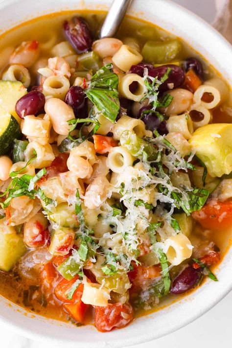 This summer minestrone soup is delicious twist on the classic Italian soup. Loaded with fresh summer vegetables and light flavors. Summer Minestrone Soup, Summer Minestrone, Summer Squash Soup, Tomato Basil Bisque, Minestrone Soup Recipe, Ditalini Pasta, Summer Vegetables, Zucchini Squash, European Recipes