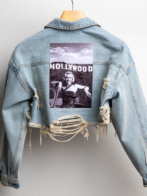 Crop distressed denim jacket, featured graphic photo of Marilyn Monroe, front button down and front pockets. " fear is stupid " embroidered on sleeve. All jackets are handmade. cotton/rayon polyester Graphic Jean Jacket, Graphic Denim Jacket, Embroidery On Denim Jackets, Lash Merch, Denim Jacket Art, Denim Jacket Back, Denim Jacket Diy Paint, Customised Denim Jacket, Graphic Photo