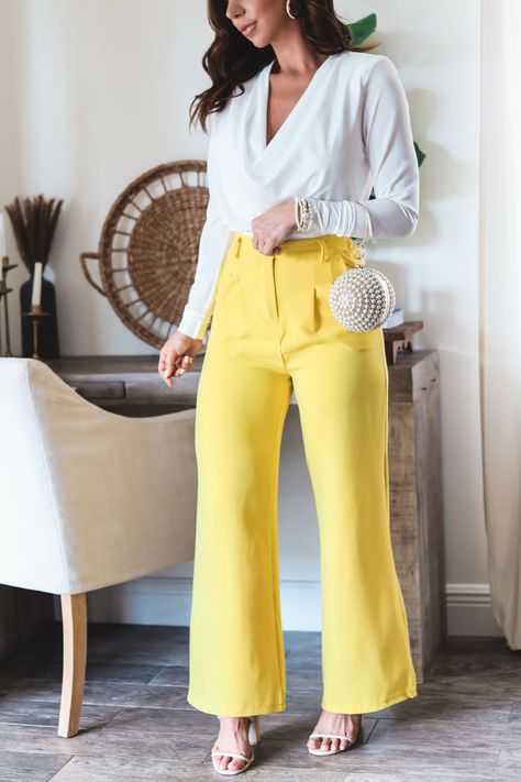 The Josie pants are such a great spring bottoms! These fitted high waisted pants are great to elevate any office attire or weekend festivities! Style with the Cindy Asymmetric Top, & Angelina Bodysuit 95%POLEYSTER 5% ELASTANE 2 Colors: Yellow & Off White Wide Leg trousers Short lining (partially lined) Half elastic waist band Zipper front closure Front Pockets Slight front pleat detail Belt Loops Fitted style We recommend sizing up if in between sizes Model is wearing medium Model is wearing a s Yellow Work Outfits For Women, Yellow And White Outfits For Women, Yellow Work Outfit, Yellow Trousers Outfit, Yellow Pants Outfit, White Wide Leg Trousers, White Outfits For Women, Wide Leg Pants Outfit, Trouser Outfit