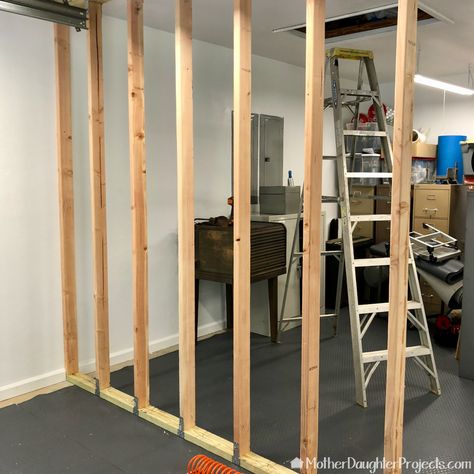 How to Build a Garage Storage Wall - Mother Daughter Projects Building A Room Inside A Garage, Garage Wall Divider Ideas, Garage Wall Divider, Garage Room Divider Ideas, Temporary Wall In Garage, Garage Partition Wall, Garage Wall Decor Ideas, Garage Divider Ideas, Shed Wall Ideas