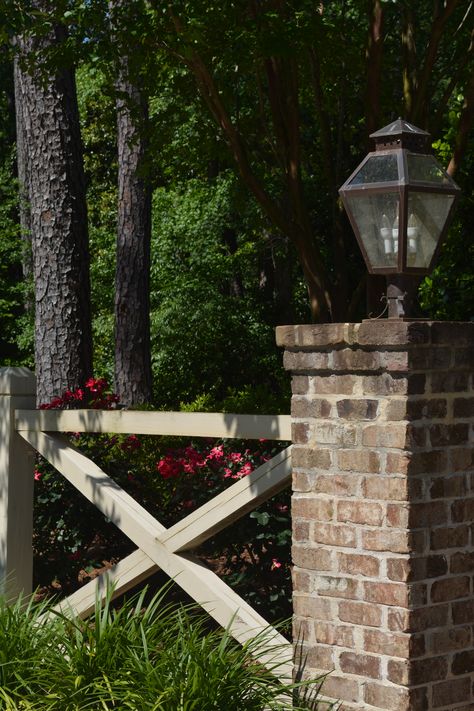 Driveway Entrance Lights, Front Driveway Fence Ideas, Fenced Driveway Entry, Wooded Driveway Landscaping, Diy Driveway Columns, Landscaping Around Culvert, Farmhouse Driveway Entrance Curb Appeal, Fence With Columns, Brick Light Post