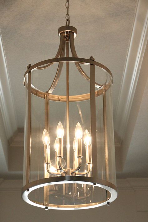 Light in Foyer Two Story Foyer Lighting, Entry Way Lighting Fixtures, Stair Landing Decor, Southern Charm Decor, Traditional Foyer, Entry Chandelier, Hallway Chandelier, Entryway Chandelier, Foyer Lighting Fixtures