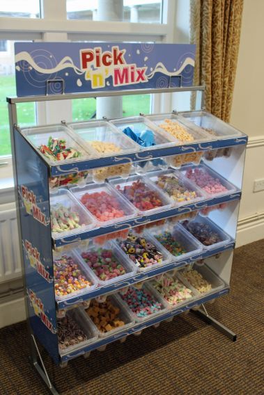 Are you sweet enough? Why not hire out our Pick n Mix Stand for your next event. Ranging of 20 different delicious sweet choices including cola bottles, jelly beans, fudge and much more weighing 40kg. This will definitely keep the party going all night! If you have a sweet tooth for something else, why not get in touch with us and we will try our best to accommodate to your needs. Covering from London, South East, Kent, Surrey, Sussex and many more! The Pick 'n' Mix is a perfect game to hire for Pick A Mix Sweets, Pick And Mix Sweets, Candy Store Design, Candy Room, Snack Cart, Mini Cafe, Candy Stand, Rainbow Party Decorations, Chocolate Stores