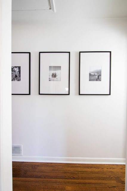 Photo Frame Hallway, Hallway Black And White Photos, Hallway Prints Entrance, Long Frames On Wall, Hallway Frame Ideas, Gallery Wall Hallway Narrow Long, Long Hallway Art Ideas, Black Picture Frames On Wall Hallways, Large Blank Wall In Bathroom