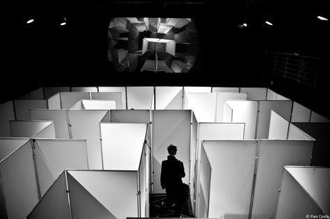 A/MAZE/ING by studio mxmxm. This installation of a maze was created during an artistic evening curated by MAZE. When the public entered the exhibition they first had to find their way through the maze. This was filmed and projected live on a big screen in front of the maze. They were brought to a higher level after finding their way making it possible to overlook the maze. #installation #maze #exhibition #design #blackandwhite #studiomxmxm Maze Installation Art, Maze Exhibition Design, Maze Exhibition, Labyrinth Installation, Maze Installation, Art Exhibition Design, Mirror Maze, Film Screening, Museum Plan