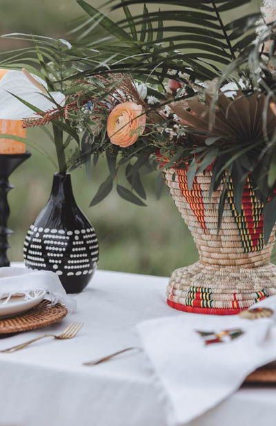 African Inspired Centerpieces, African Wedding Decorations Ideas, African Themed Centerpieces, Afro Bohemian Wedding, Modern African Wedding Decor, Afrocentric Wedding Decor, African Flower Arrangements, African Wedding Table Decor, African Wedding Color Schemes