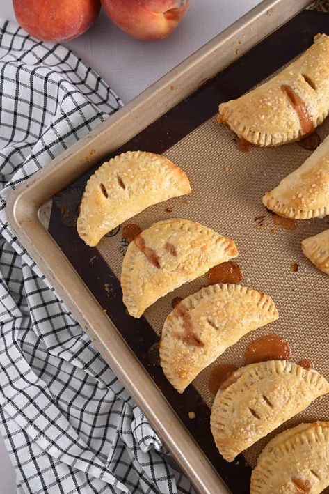 Peach hand pies are the ultimate late summer dessert. With a buttery pie crust, filling made with summer-ripe fresh peaches, and crunchy sugar on top, these are hand-held gems of peach pie goodness. Hand Held Peach Pies, Peach Hand Pies Recipes, Peach Hand Pies With Fresh Peaches, Hand Pie Dough Recipe, Hand Pie Crust, Hand Pies Dough Recipes, Fruit Hand Pies, Peach Hand Pies, Pie Pastry Recipe