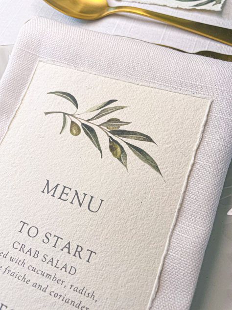 OLIVE MENU MINIMUM ORDER OF 10 This exquisite wedding menu features a beautiful watercolour olive branch printed onto luxurious handmade recycled 320gsm cotton paper with a delicate hand torn deckled edge. Handmade in my Devon studio by the sea. Size 10 x 19cm || TO ORDER || Please detail your wedding menu in the personalisation box when ordering and add the quantity you need when the item is in your basket.  Please check the wording of your menu carefully as your exact phrases and words will be used. || PLEASE NOTE || Please note that due to the handmade nature of the recycled cotton paper, slight variances in colour may occur and speckles may be present in the paper. || MATCHING PRODUCTS || This design is also available as place cards, calligraphy place cards, personalised table numbers Italian Wedding Menu Ideas, 2026 Wedding, Olive Branch Wedding, 21 Diner, Olive Wedding, Leaf Monogram, Wedding Aesthetics, Menu Wedding, Wedding Menu Cards