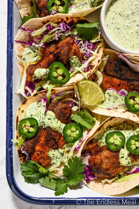 These pork belly tacos are the best of all worlds! Warm tortillas are stuffed with seasoned pork belly, crunchy cabbage, cilantro, and a drizzle of our easy homemade taco sauce. They come together easily and they're ready in an hour! #theendlessmeal #tacos #porkbellytacos #porkbelly #porktacos #pork #dinner #mexican #texmex Blackened Fish Tacos, Blackened Fish, Blacken Fish, Avocado Dessert, Cilantro Sauce, Munnar, Dash Diet, God Mat, Think Food