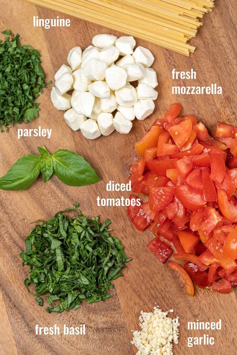 The ingredients for Caprese pasta include diced tomatoes, fresh mozzarella, minced garlic, extra-virgin olive oil, fresh basil and parsley, and linguine. Tomato Mozzarella Basil Pasta, Tomato Basil Garlic Pasta, Pasta Recipes With Mozzarella Cheese, Pasta With Tomatoes And Basil, Pasta With Fresh Mozzarella, Mozzarella Pasta Recipes, Fresh Mozzarella Pasta, Caprese Salad Pasta, Vegan Drinks Healthy