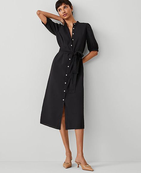 A stand collar adds a refined air to our puff sleeve midi shirtdress, cinched with a flattering tie waist. Stand collar. Short sleeves with shirred sleeve caps. Button front placket. Self tie belt. Lined body.,Hit:Hits at mid-calf,Imported:Imported,Length:27" from natural waist,Fabrication:100% Polyester,Garment Care:Machine Washable Petite Stand Collar Belted Midi Shirtdress by Ann Taylor Size petite - 00 Black Women's Shirtdress, Regular, Split, Neck, Short, Sleeve, Dresses, 100%, Polyester, Machine, Washable Casual Winter Dresses For Women Over 50, Ann Taylor Outfits, Travel Dresses, Office Fits, Fall Style Guide, Midi Dress Fall, Plaid And Leopard, Perfect Fall Outfit, Short Sleeve Midi Dress