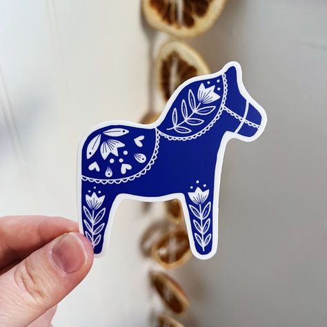 Add a touch of Scandinavian style to your home with this beautiful Dala Horse sticker. Made of high-quality vinyl, this sticker is easy to apply and remove, and it will last for years. #dalahorse #nordic #scandinavian . #Sticker_Page #Weird_Stickers #Nordic_Winter #Parade_Floats Weird Stickers, Manual Work, Nordic Scandinavian, Swedish Christmas, Folk Style, Parade Float, Blue Horse, Horse Tattoo, Dala Horse