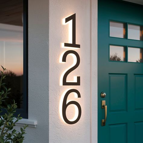 Welcome to WallArtDIY! To learn more about our custom metal house number, please take a moment to read the information below: All signs are personalized and fully customizable. You can request any size and design you desire, and I'm here to assist you in making your vision a reality. My metal house sign with LED neon lighting is a versatile home decor product, tailored to add a personalized touch to your home or business. Crafted from high-quality brushed steel or mirror steel, it features built Black Address Numbers On House, Address Numbers On House Front Porches, House Numbers Ideas Outdoor, Backlit House Numbers, Front Porch Stone Steps, House Number Ideas Outdoor, Lighted House Numbers, Front Porch Stone, Metal House Signs